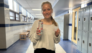 Emma Gillman (12) shows off a Celsius energy drink.
